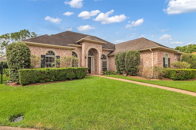 12715 Havant Cir, Houston, TX 77077 - view of front facade featuring brick siding and roof with shingles