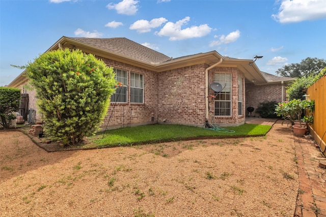 12715 Havant Cir, Houston, TX 77077 - view of side of home featuring brick siding and roof with shingles