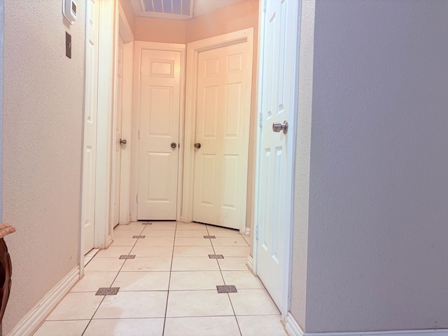 12943 Bamboo Forest Trl, Houston, TX 77044 - hall with a textured wall and light tile patterned floors