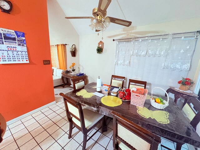 12943 Bamboo Forest Trl, Houston, TX 77044 - dining area with vaulted ceiling, a ceiling fan, and light tile patterned flooring