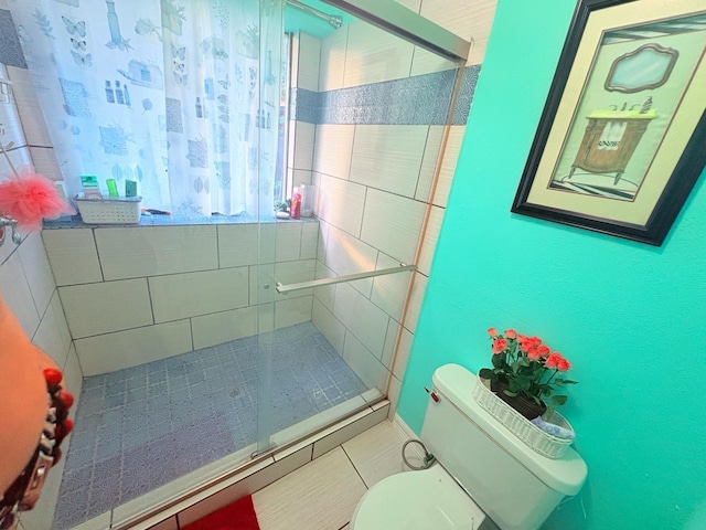 12943 Bamboo Forest Trl, Houston, TX 77044 - bathroom with a stall shower and tile patterned flooring