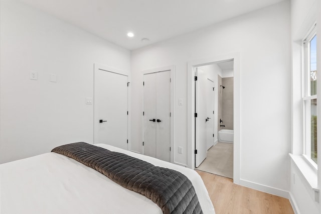 1018 Patton St, Houston, TX 77009 - bedroom with light wood-type flooring, recessed lighting, and ensuite bathroom