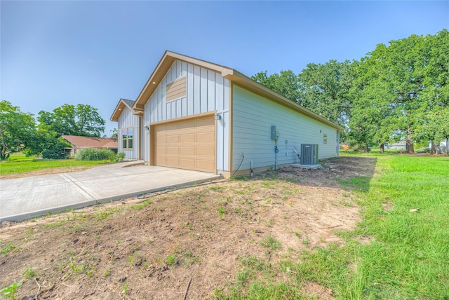 175 Echo Ln, Livingston, TX 77351 - view of home's exterior featuring board and batten siding, concrete driveway, and an attached garage