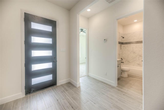 175 Echo Ln, Livingston, TX 77351 - foyer entrance featuring light wood finished floors and recessed lighting