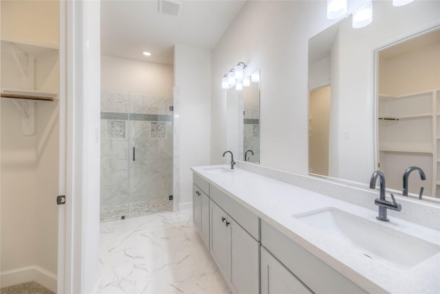 175 Echo Ln, Livingston, TX 77351 - full bath with a spacious closet, a marble finish shower, double vanity, marble finish floors, and recessed lighting