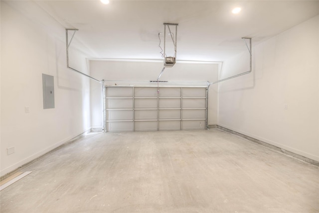 175 Echo Ln, Livingston, TX 77351 - garage featuring electric panel and a garage door opener