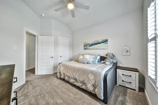 3140 Red Buckeye Ln, Conroe, TX 77301 - carpeted bedroom with vaulted ceiling and a ceiling fan