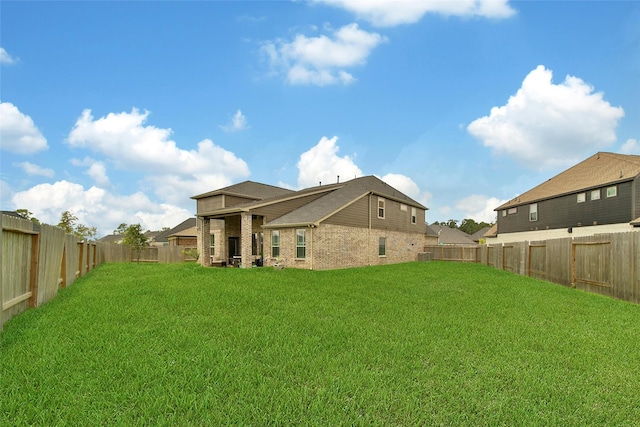 3140 Red Buckeye Ln, Conroe, TX 77301 - rear view of property featuring a fenced backyard and brick siding