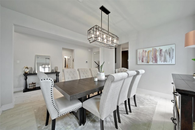 3140 Red Buckeye Ln, Conroe, TX 77301 - dining area featuring a chandelier and baseboards