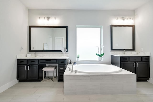 3140 Red Buckeye Ln, Conroe, TX 77301 - bathroom with a bath and two vanities
