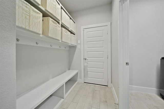3140 Red Buckeye Ln, Conroe, TX 77301 - mudroom with light wood-style flooring and baseboards