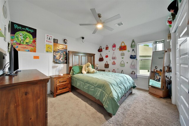 3140 Red Buckeye Ln, Conroe, TX 77301 - bedroom with light colored carpet, vaulted ceiling, and ceiling fan