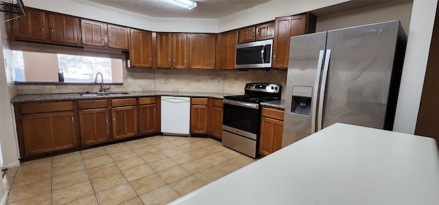 16755 Maplemont Dr, Houston, TX 77095 - kitchen featuring stainless steel appliances, backsplash, and light tile patterned flooring