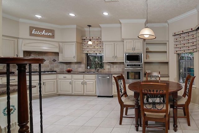 15 Amber Sky Pl, The Woodlands, TX 77381 - kitchen with appliances with stainless steel finishes, light tile patterned floors, tasteful backsplash, open shelves, and a textured ceiling