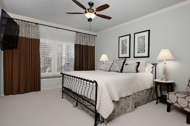 15 Amber Sky Pl, The Woodlands, TX 77381 - bedroom featuring carpet, ornamental molding, a ceiling fan, and a textured ceiling