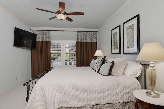 15 Amber Sky Pl, The Woodlands, TX 77381 - bedroom featuring carpet floors, crown molding, a textured ceiling, and ceiling fan