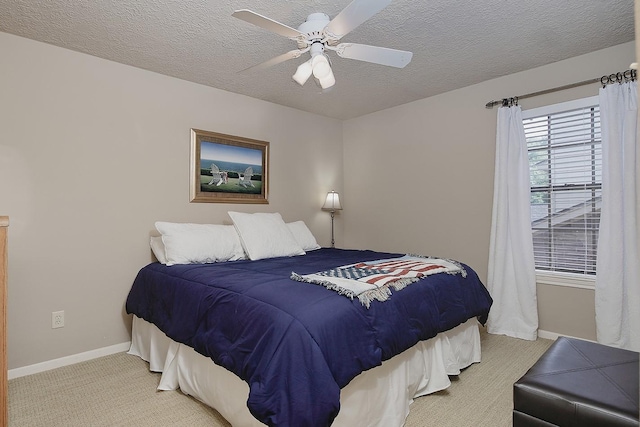 15 Amber Sky Pl, The Woodlands, TX 77381 - bedroom featuring carpet floors, a textured ceiling, and a ceiling fan