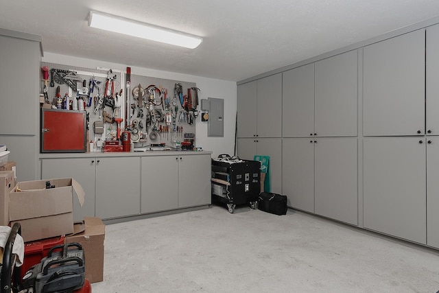 15 Amber Sky Pl, The Woodlands, TX 77381 - garage with electric panel and a workshop area