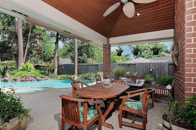 15 Amber Sky Pl, The Woodlands, TX 77381 - fenced backyard featuring ceiling fan, a patio area, and outdoor dining space