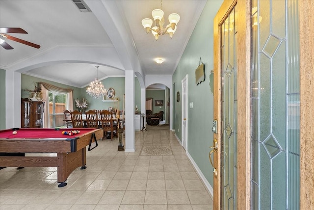 10002 Dawn Brook Dr, Pearland, TX 77584 - recreation room featuring a chandelier, arched walkways, a ceiling fan, ornamental molding, and light tile patterned flooring