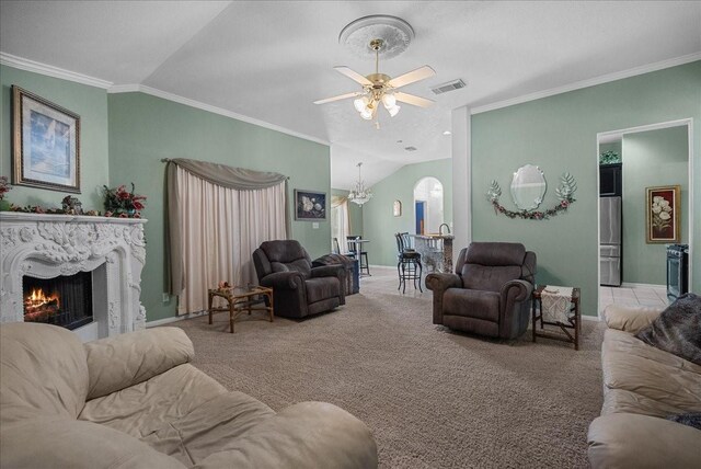 10002 Dawn Brook Dr, Pearland, TX 77584 - living area featuring vaulted ceiling, light carpet, a fireplace, arched walkways, and a ceiling fan