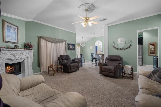 10002 Dawn Brook Dr, Pearland, TX 77584 - carpeted living area featuring lofted ceiling, arched walkways, a high end fireplace, ornamental molding, and a ceiling fan