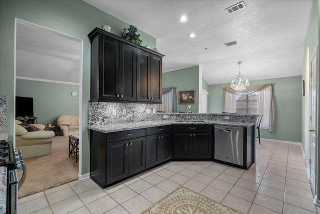 10002 Dawn Brook Dr, Pearland, TX 77584 - kitchen with dishwasher, light tile patterned floors, a chandelier, a peninsula, and backsplash