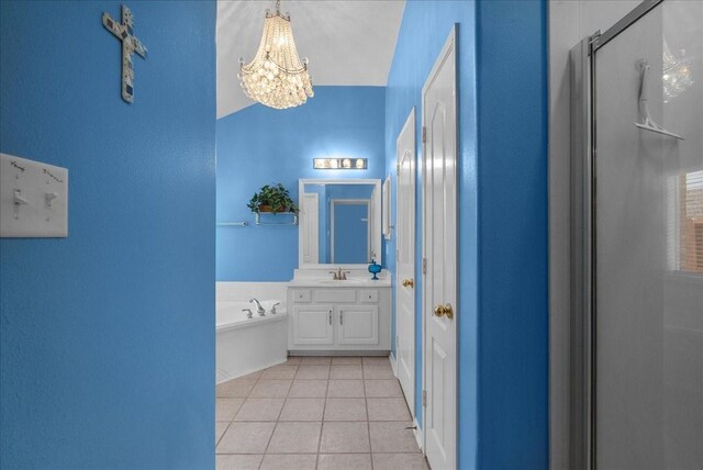 10002 Dawn Brook Dr, Pearland, TX 77584 - full bath featuring a chandelier, vanity, tile patterned flooring, a stall shower, and a garden tub