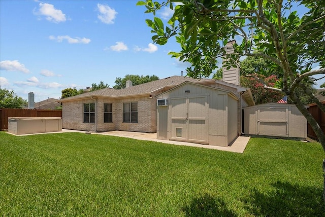 10002 Dawn Brook Dr, Pearland, TX 77584 - rear view of property with a shed, a chimney, a fenced backyard, a patio area, and a hot tub
