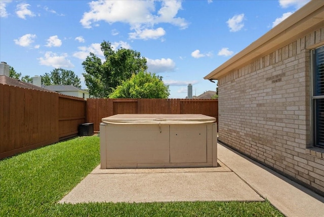10002 Dawn Brook Dr, Pearland, TX 77584 - fenced backyard with a hot tub and a patio area