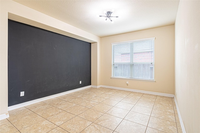 22411 Limestone Crest Ln, Katy, TX 77449 - empty room featuring light tile patterned flooring and baseboards