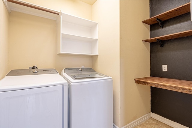 22411 Limestone Crest Ln, Katy, TX 77449 - washroom featuring washer and clothes dryer and light tile patterned floors
