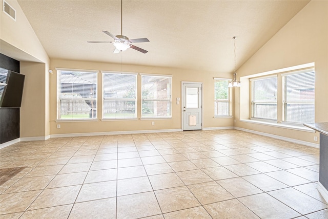 22411 Limestone Crest Ln, Katy, TX 77449 - unfurnished living room featuring lofted ceiling, ceiling fan, healthy amount of natural light, a chandelier, and light tile patterned flooring