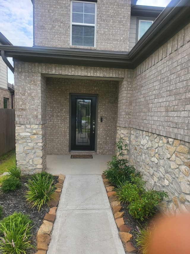 5731 Fresh View Ct, Katy, TX 77493 - view of exterior entry with a porch and brick siding