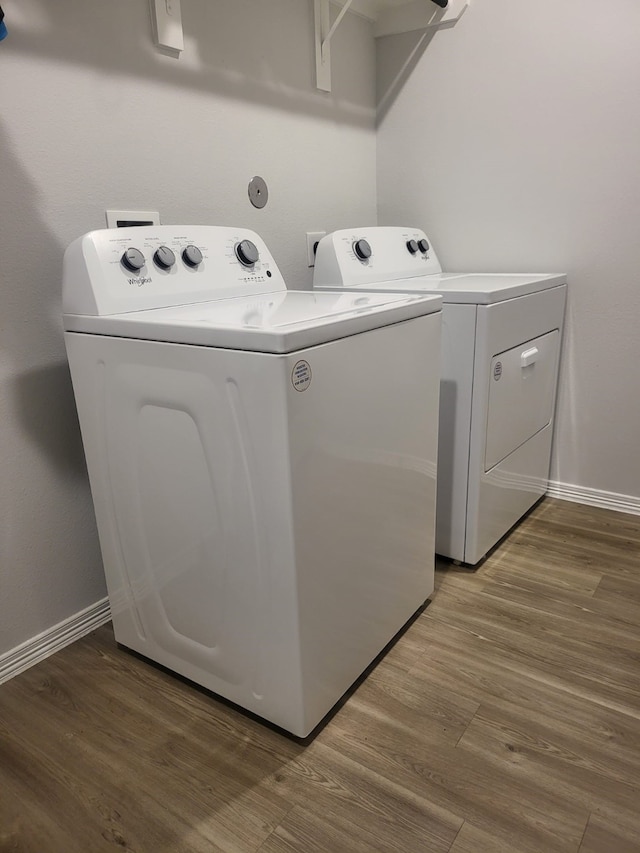 5731 Fresh View Ct, Katy, TX 77493 - laundry room with washing machine and dryer and wood finished floors