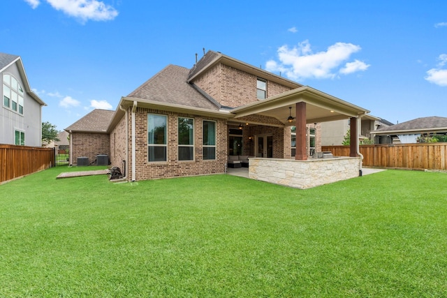 4038 Sabine Valley Trl, Spring, TX 77386 - back of house with a fenced backyard, brick siding, ceiling fan, and roof with shingles