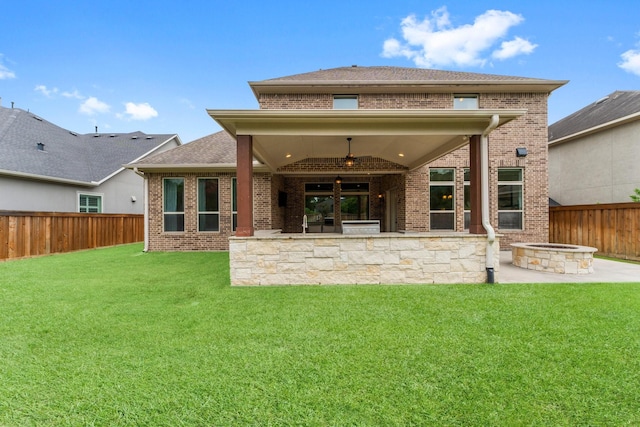 4038 Sabine Valley Trl, Spring, TX 77386 - rear view of property featuring an outdoor fire pit, brick siding, a fenced backyard, a patio area, and a ceiling fan