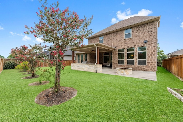 4038 Sabine Valley Trl, Spring, TX 77386 - rear view of house with a patio, a fenced backyard, a ceiling fan, brick siding, and a fire pit
