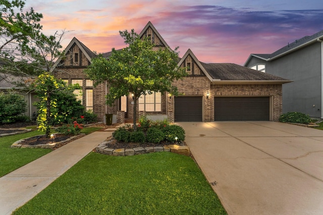 4038 Sabine Valley Trl, Spring, TX 77386 - view of front of home with a front yard, brick siding, an attached garage, and concrete driveway