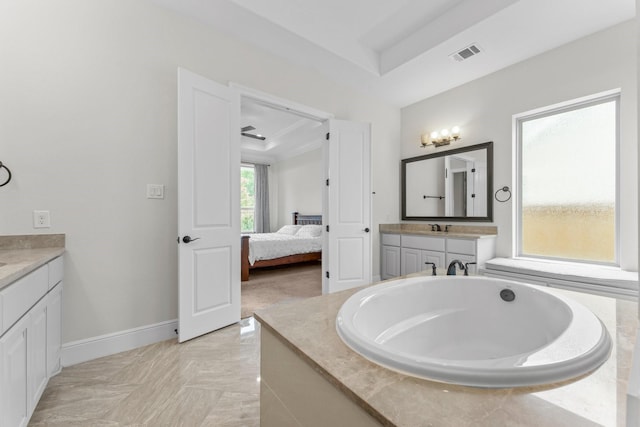 4038 Sabine Valley Trl, Spring, TX 77386 - ensuite bathroom with vanity, a raised ceiling, and a bath