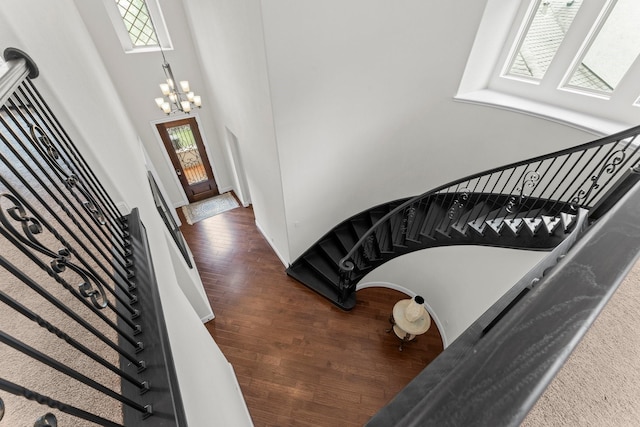 4038 Sabine Valley Trl, Spring, TX 77386 - entrance foyer featuring a chandelier, dark wood finished floors, stairs, and a high ceiling