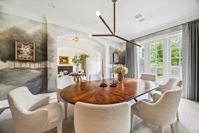 10825 Smithdale Rd, Houston, TX 77024 - dining area with ornamental molding, arched walkways, and a fireplace