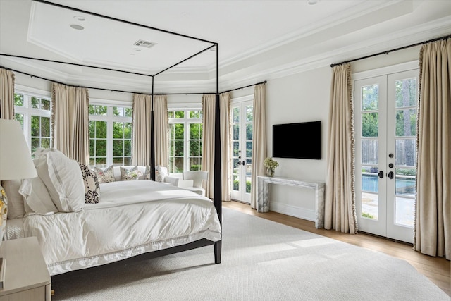 10825 Smithdale Rd, Houston, TX 77024 - bedroom with access to exterior, crown molding, a tray ceiling, french doors, and multiple windows