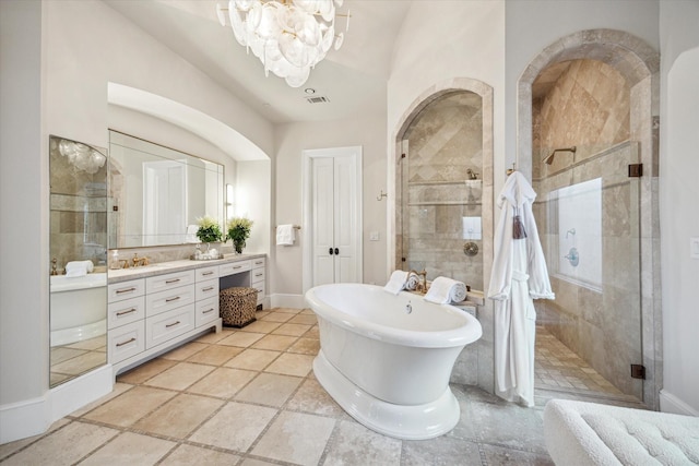 10825 Smithdale Rd, Houston, TX 77024 - bathroom with vanity, a stall shower, a chandelier, a freestanding tub, and lofted ceiling