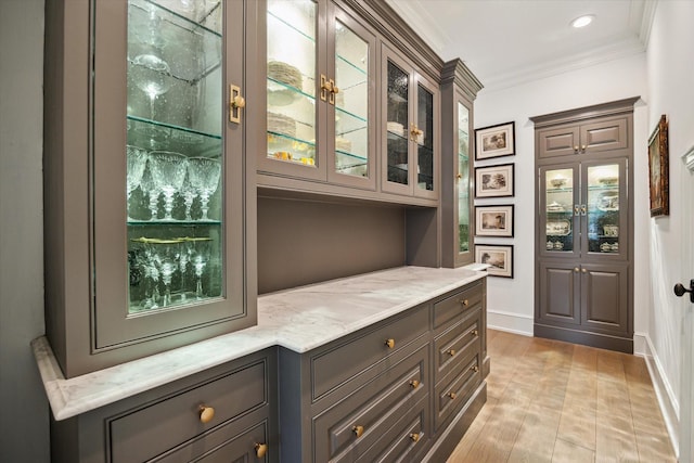 10825 Smithdale Rd, Houston, TX 77024 - bar featuring crown molding and light wood-type flooring