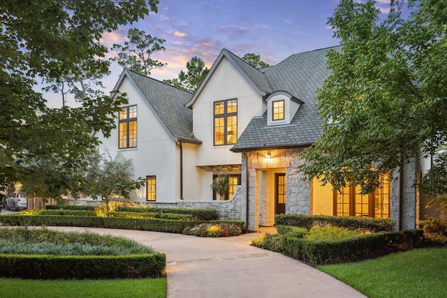 10825 Smithdale Rd, Houston, TX 77024 - french country style house featuring stone siding, a high end roof, and stucco siding
