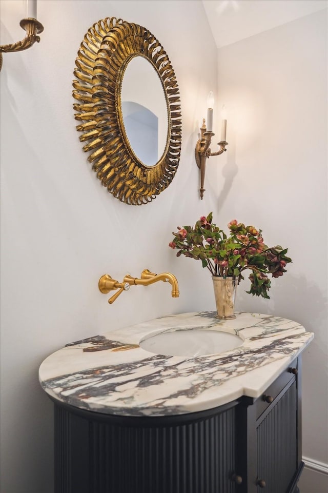 10825 Smithdale Rd, Houston, TX 77024 - bathroom featuring vanity and lofted ceiling