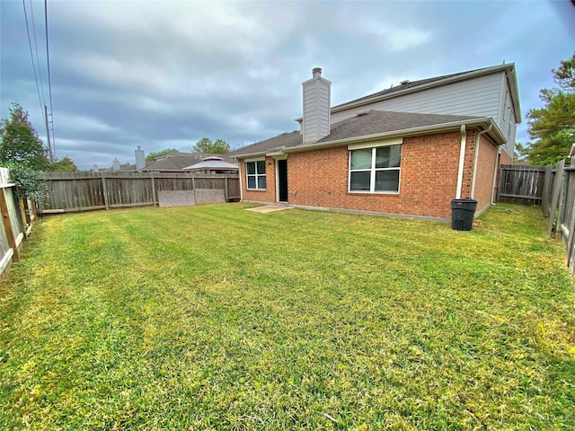 17419 Prospect Meadows Dr, Houston, TX 77095 - rear view of property with a chimney, brick siding, and a fenced backyard
