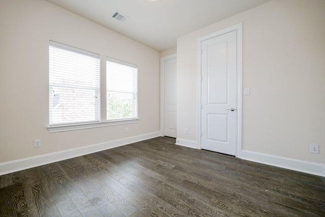 8682 Green Kolbe Ln, Houston, TX 77080 - unfurnished bedroom with dark wood-style floors and baseboards