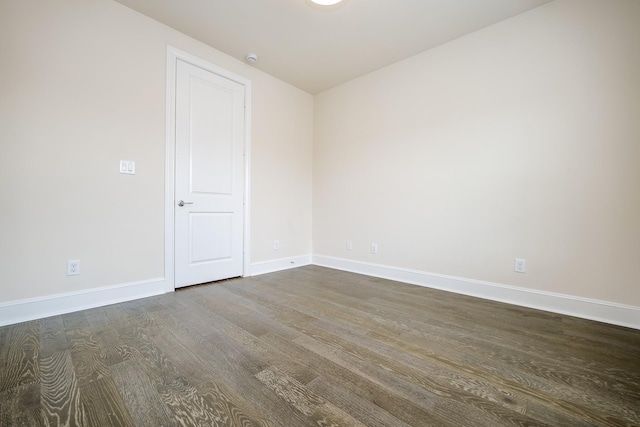 8682 Green Kolbe Ln, Houston, TX 77080 - unfurnished room featuring dark wood-style flooring and baseboards
